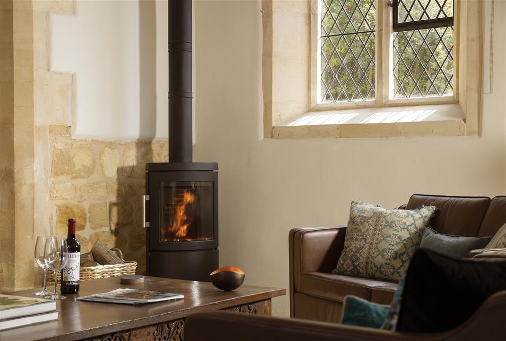 Ground floor: Wood burning stove for those cooler evenings at The Old Mission Church, Paxford, near Chipping Campden