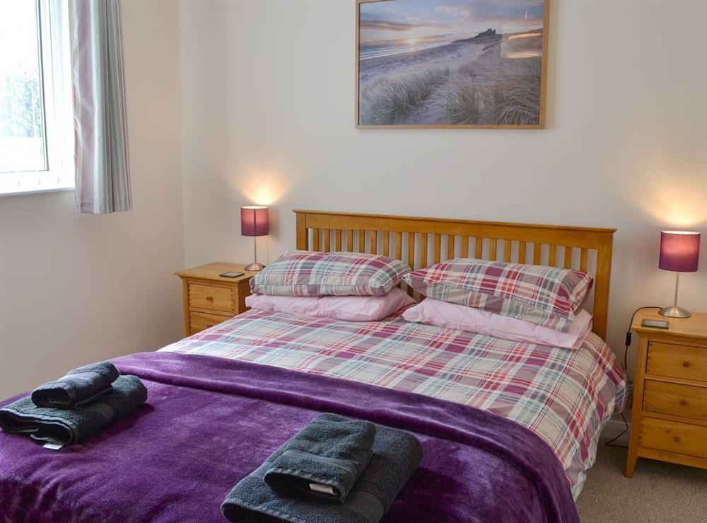 Cosy and inviting double bedroom with kingsize bed at The Old Parish Hall in Seahouses, near Alnwick, Northumberland