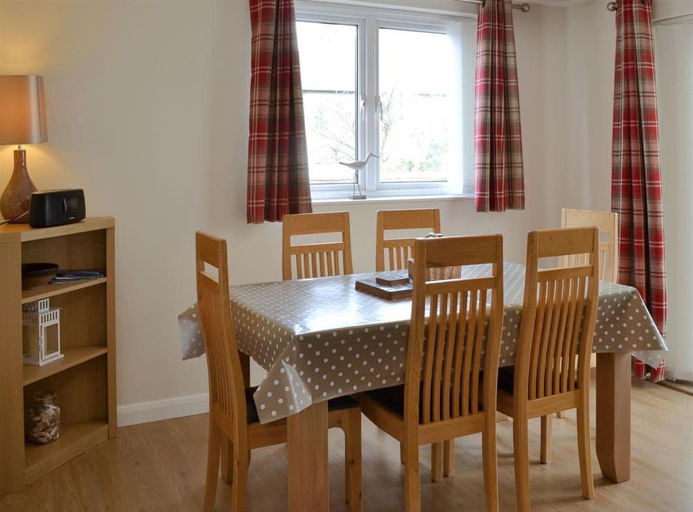 Living/dining area with homely yet contemporary feel at The Old Parish Hall in Seahouses, near Alnwick, Northumberland