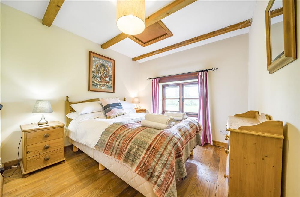 Bedroom four, situated on the first floor, with a 4’6 double bed and en-suite shower room at The Old Piggeries, Burton Bradstock, Bridport