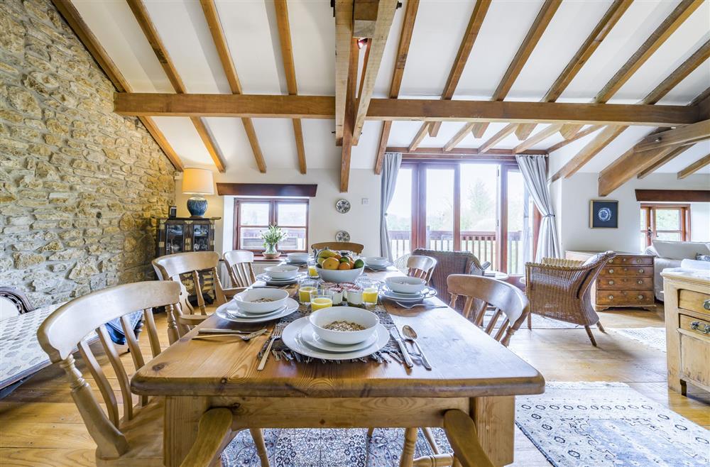 Dining area with seating for up to seven guests at The Old Piggeries, Burton Bradstock, Bridport