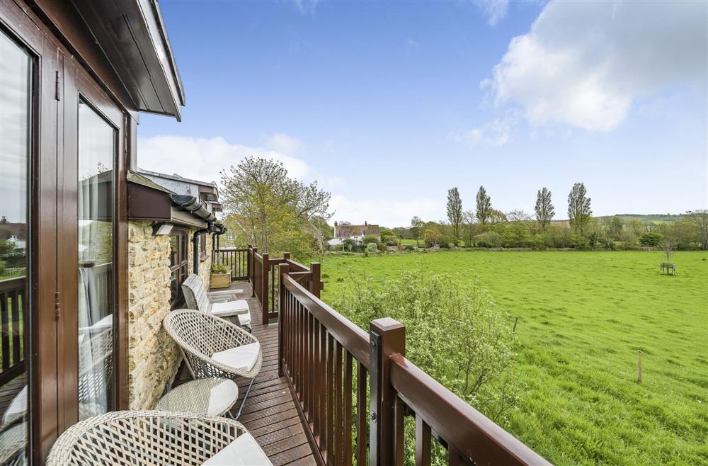 First floor balcony with beautiful countryside views at The Old Piggeries, Burton Bradstock, Bridport