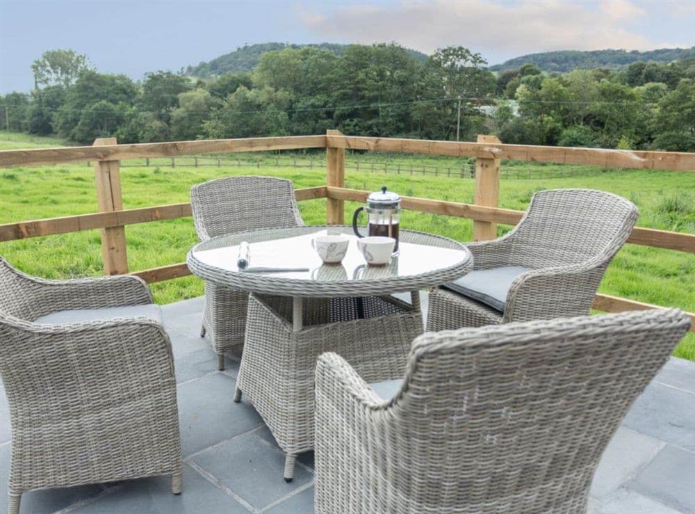 Outdoor eating area at The Old Piggery in Sidbury, near Sidmouth, Devon