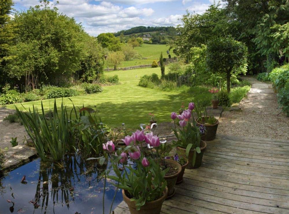 Extensive gardens at The Old Pool House in Sevenhampton, near Cheltenham, Glos., Gloucestershire