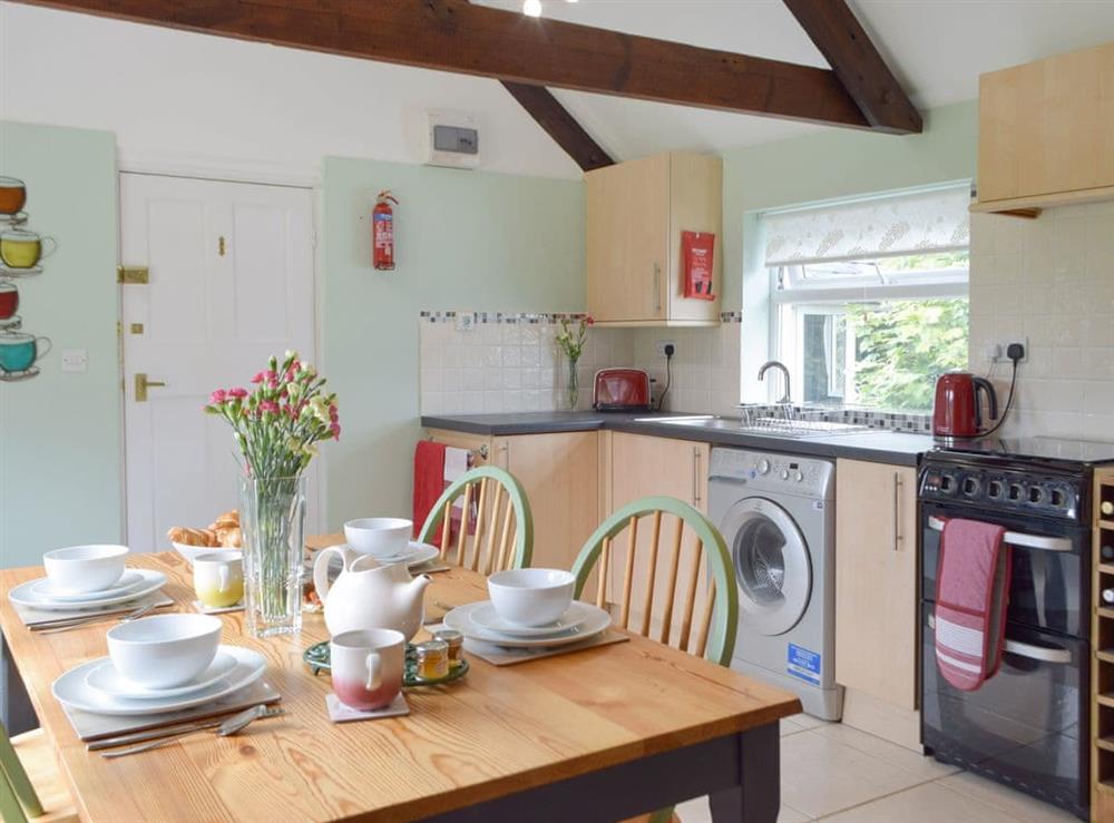 Convenient dining area within kitchen at The Old Post House in Penffordd, near Narberth, Dyfed