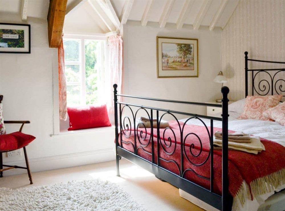 Comfortable double bedroom at The Old Post Office in Chedworth, near Cheltenham, Gloucestershire