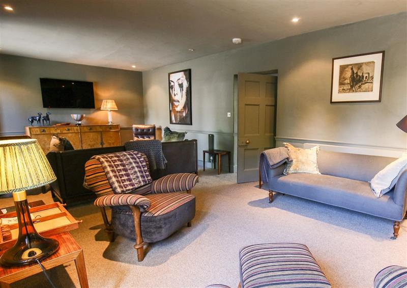 Relax in the living area at The Old Post Office, Coln St Aldwyns