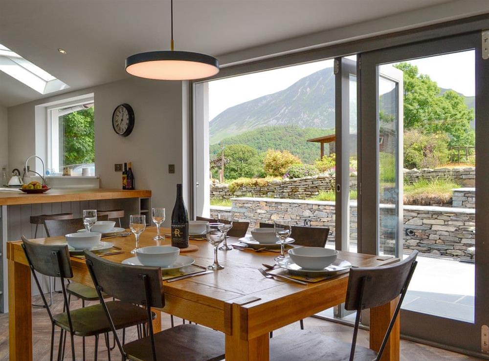 Contemporary open-plan living space with ideally place dining area at The Old Post Office Gillerthwaite in Loweswater, near Cockermouth, Cumbria