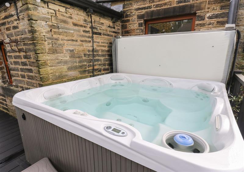 Enjoy the hot tub at The Old Post Office, Holmfirth