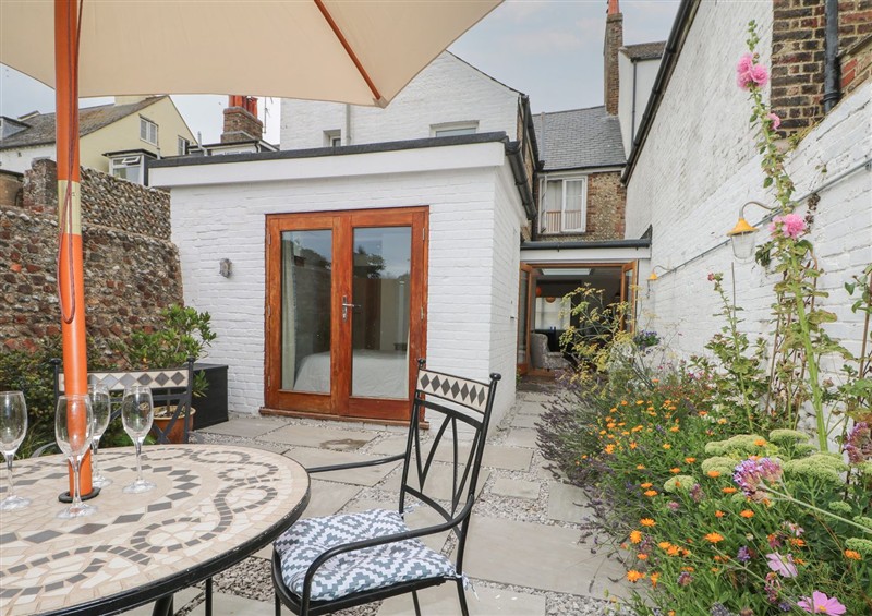 Enjoy a glass of wine on the patio at The Old Post Office, Littlehampton