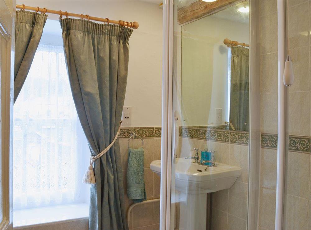 The modest shower room is great for large groups of guests at The Old Post Office in Myddfai, near Llandovery, Dyfed