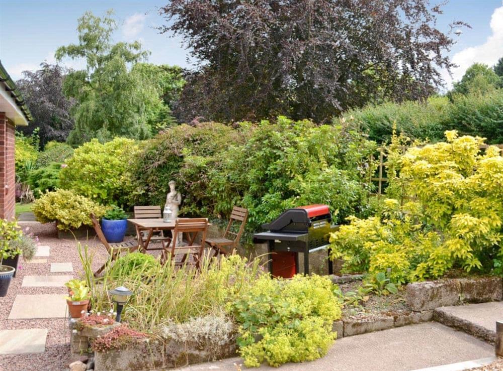 Garden with dining area & BBQ at The Old Post Office in Ruckhall, Eaton Bishop, near Hereford, Herefordshire