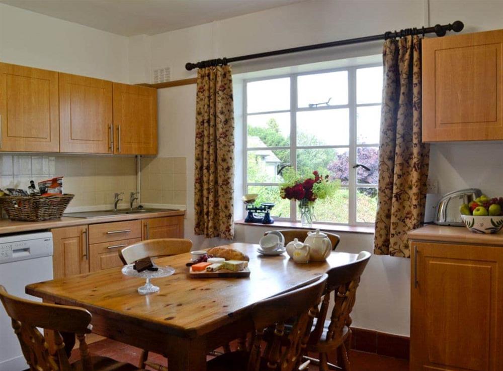 Kitchen with dining area at The Old Post Office in Ruckhall, Eaton Bishop, near Hereford, Herefordshire