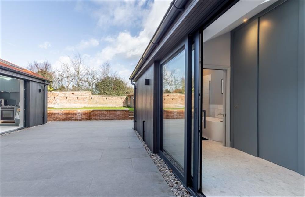 Ground floor: Sliding doors from the utility to courtyard at The Old Post Office, Wells-next-the-Sea