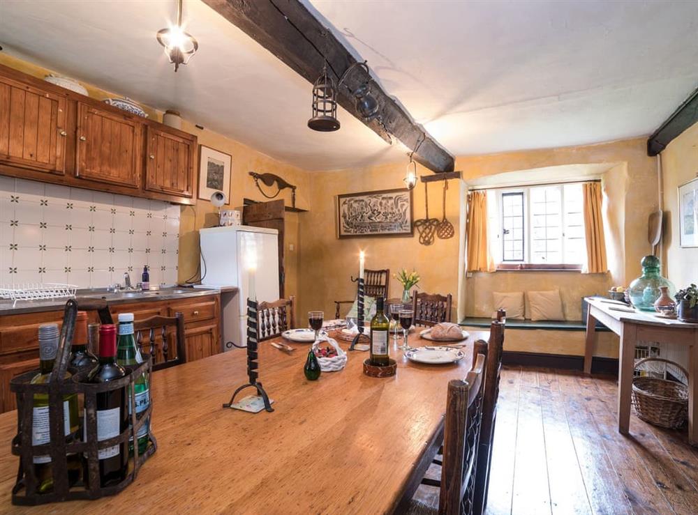 Kitchen with dining area at The Old Priory Cottage in Dunster, near Minehead, Somerset
