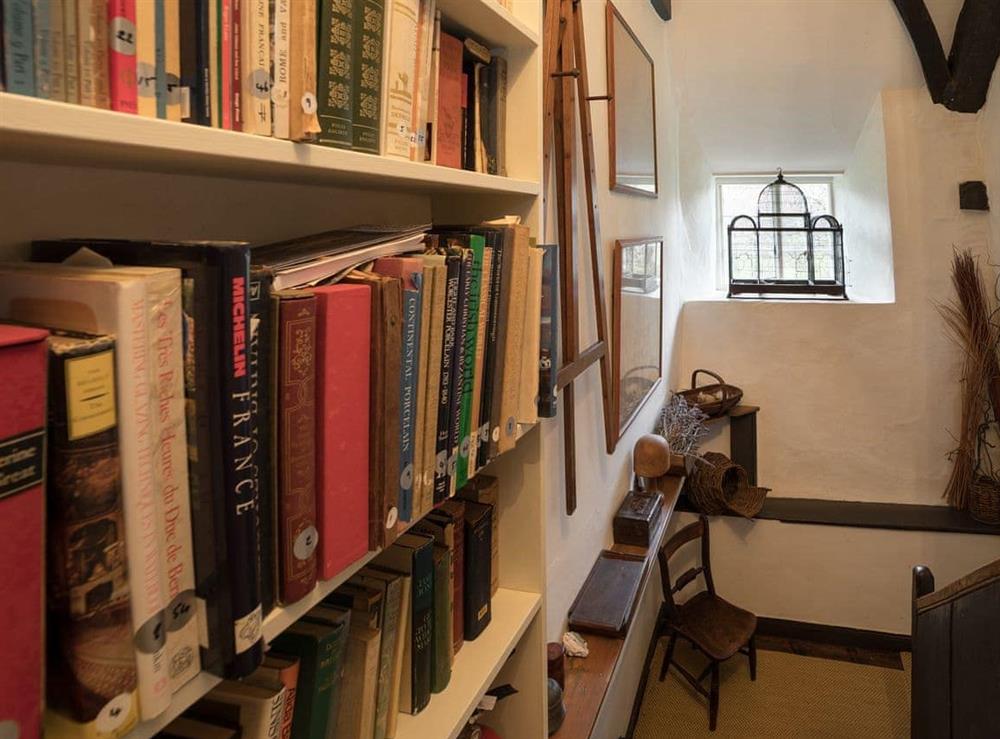 Small library area at The Old Priory Cottage in Dunster, near Minehead, Somerset