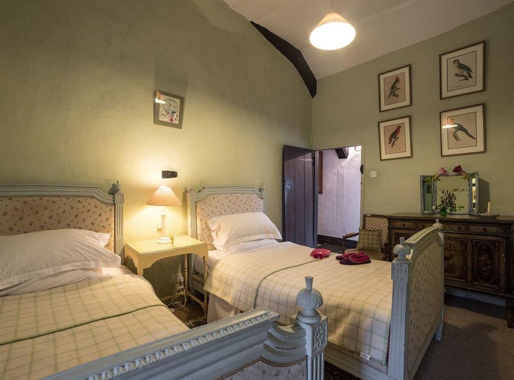 Twin bedroom at The Old Priory Cottage in Dunster, near Minehead, Somerset