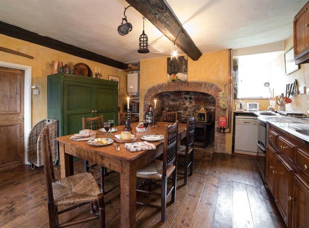Welcoming dining area at The Old Priory Cottage in Dunster, near Minehead, Somerset