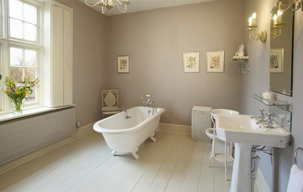 Bathroom with roll top bath, spray attachment and wc at The Old Rectory and Coach House, North Tuddenham