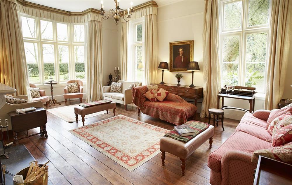 Large drawing room with open fire at The Old Rectory and Coach House, North Tuddenham