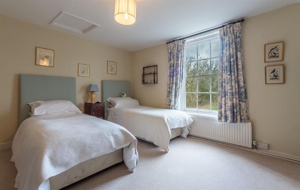 First floor: Bedroom four with twin beds at The Old Rectory, Heveningham