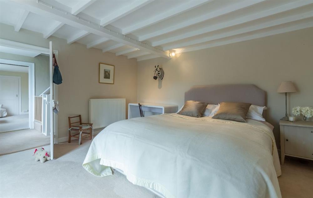 First floor: Bedroom two with  king-size bed at The Old Rectory, Heveningham