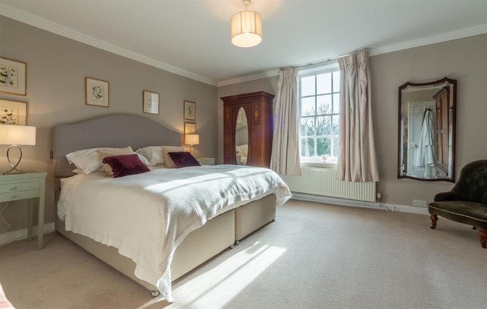 First floor: Master bedroom with super-king bed at The Old Rectory, Heveningham