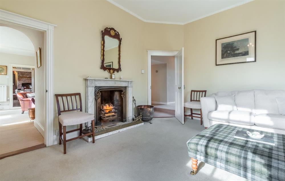 Ground floor: Sitting room with open fireplace at The Old Rectory, Heveningham