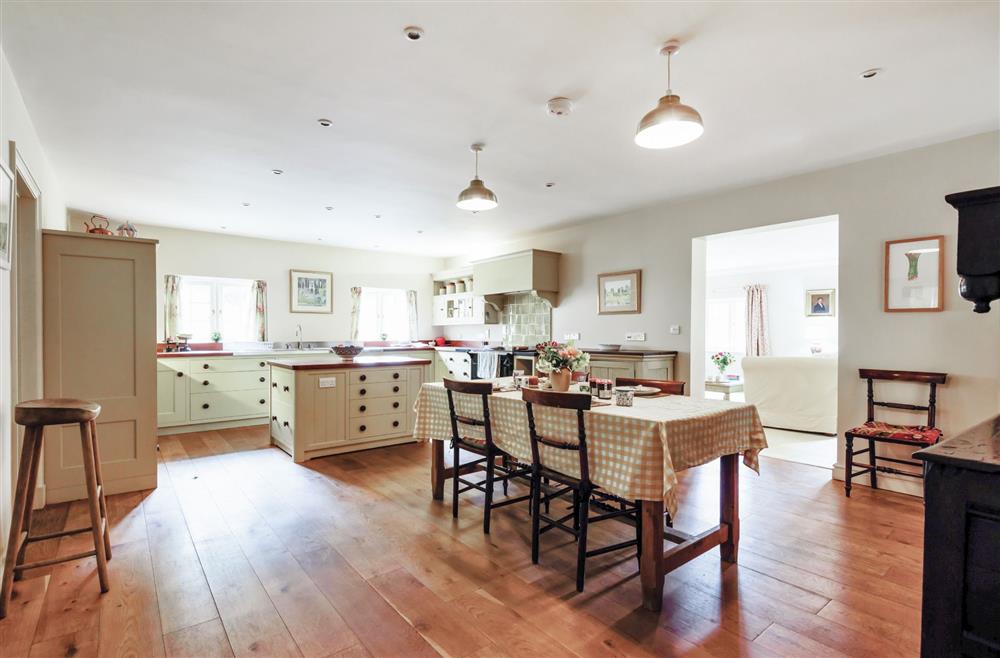 The dining area and kitchen island at The Old Rectory Lodge, Dorchester