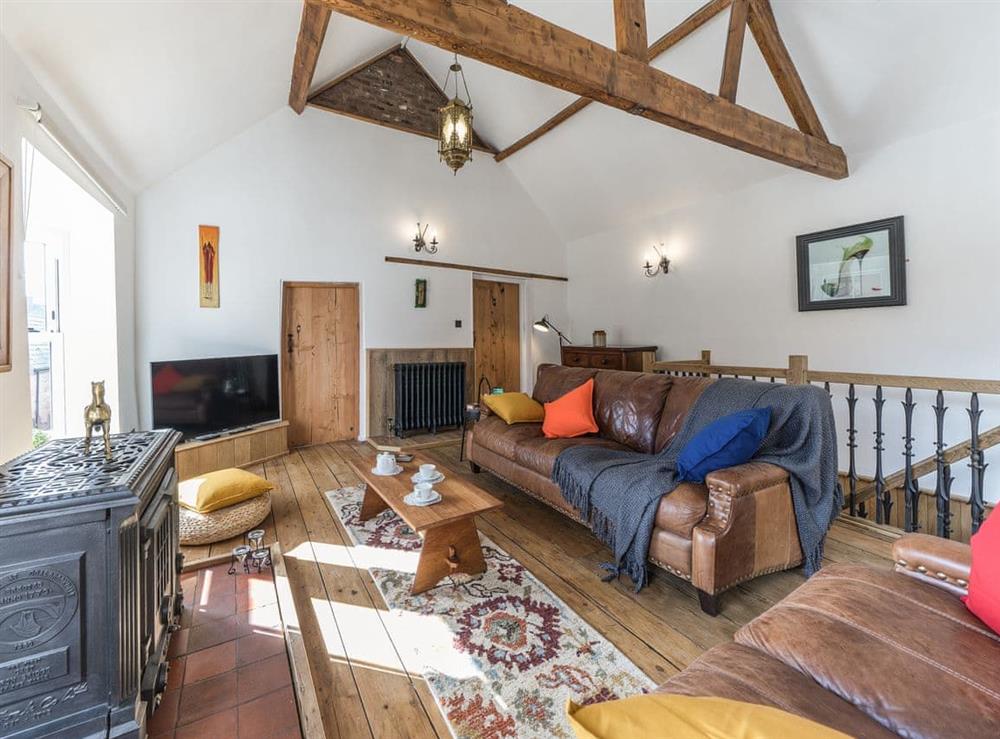 Living room with vaulted ceiling and wood beams at The Old Rope Works in Bewdley, Worcestershire