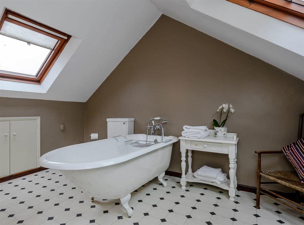 Bathroom with stand alone bath at The Old Saddlery in Colkirk, near Falkenham, Norfolk