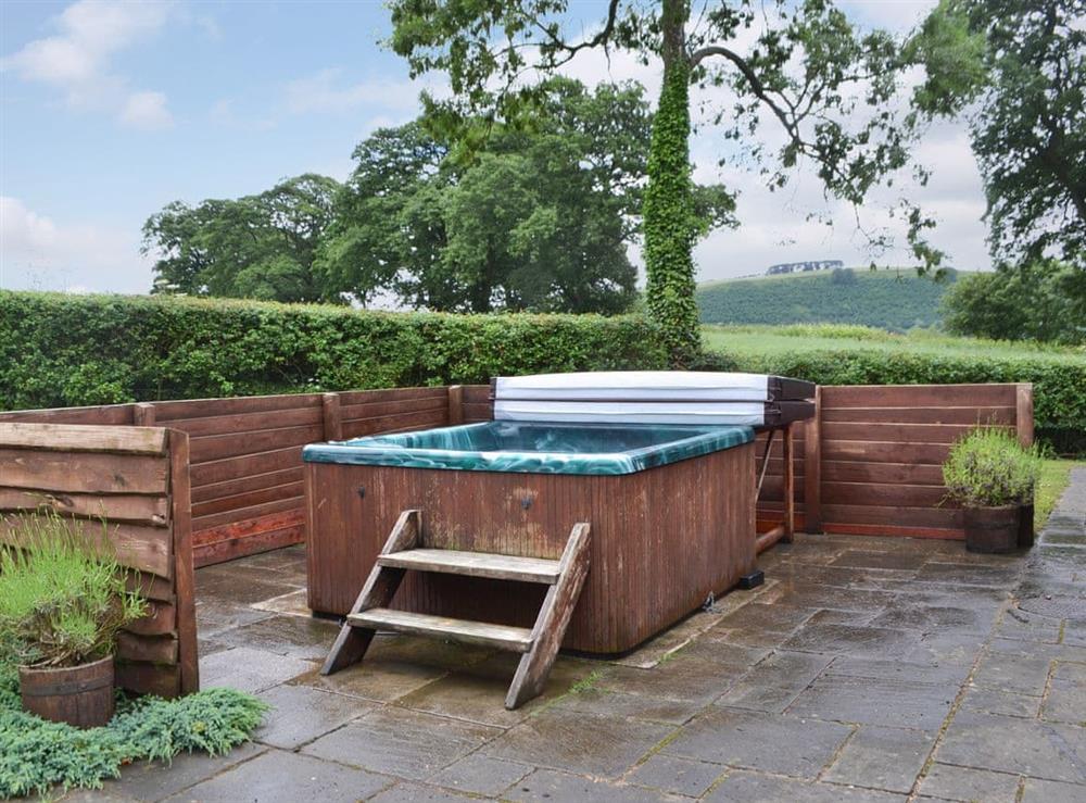Relax in the private hot tub at The Old Sawmill in Bucknell, Shropshire