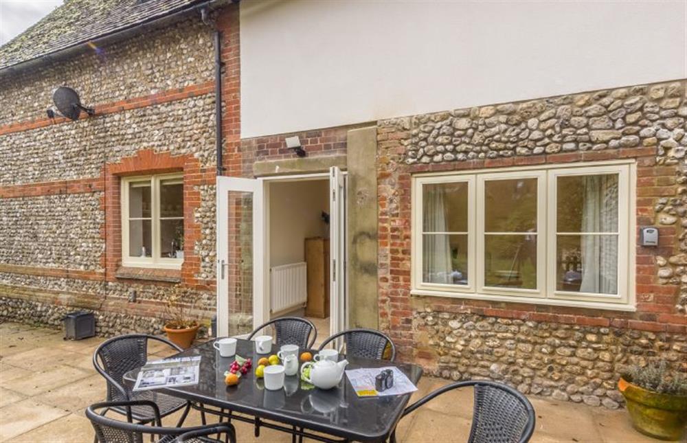 Outside is a patio area for alfresco dining at The Old School House, Docking near Kings Lynn