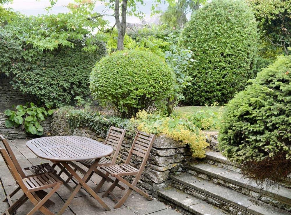 Wonderful garden with south-facing patio and furniture at The Old School House in Icomb, near Stow-on-the-Wold, Gloucestershire