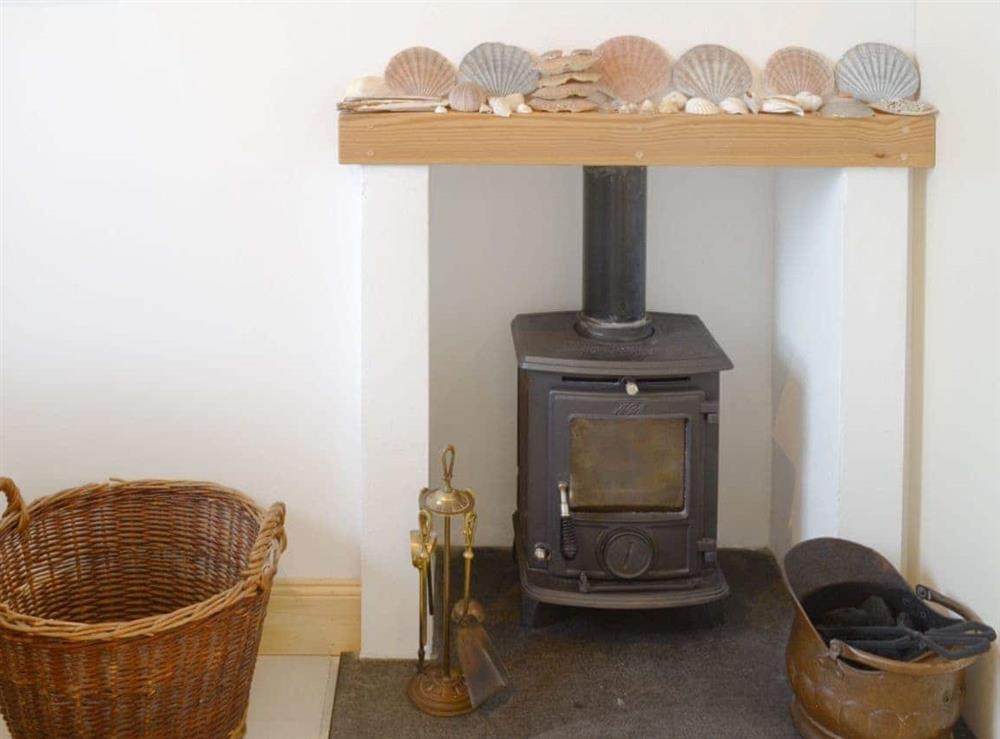 Multi-fuel burner in the kitchen/ dining room at The Old School House in Lonbain, by Applecross, Wester Ross., Ross-Shire