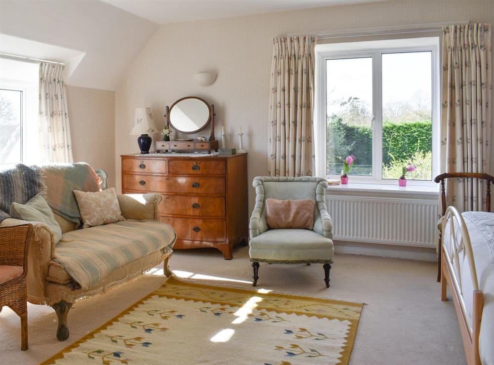 Stylish master bedroom at The Old School House in Lower Bockhampton, near Dorchester, Dorset