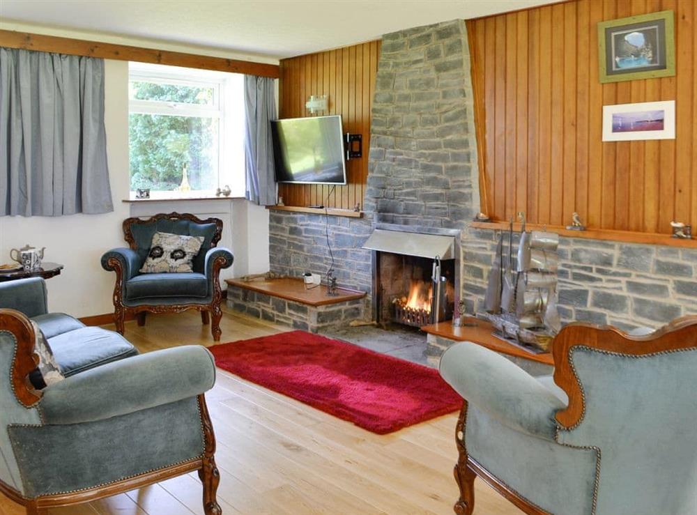 Spacious living area with open-fire at The Old School House in Portpatrick, near Stranraer, Wigtownshire
