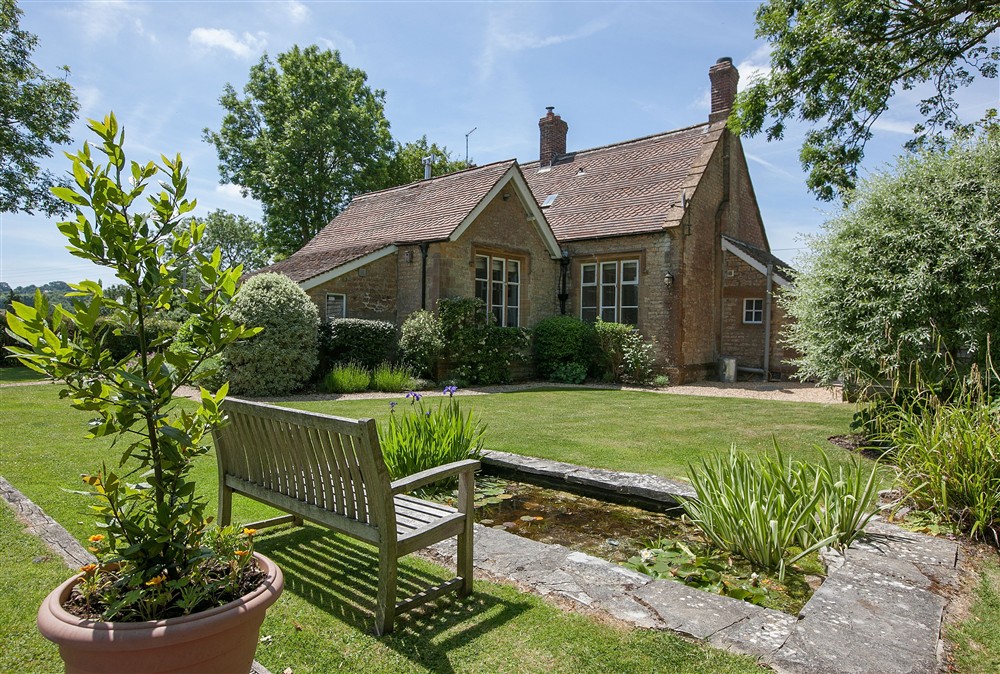 a charming stone and tiled holiday country cottage which used to be the village school at The Old School, South Perrott