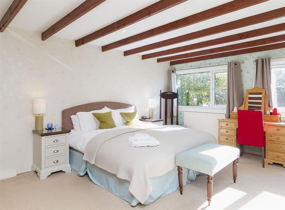 The beamed double bedroom is light and airy at The Old Smithy in Appin, Argyll