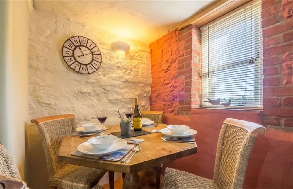 Ground floor: Dining table with seating for four at The Old Smithy, Holme-next-the-Sea near Hunstanton