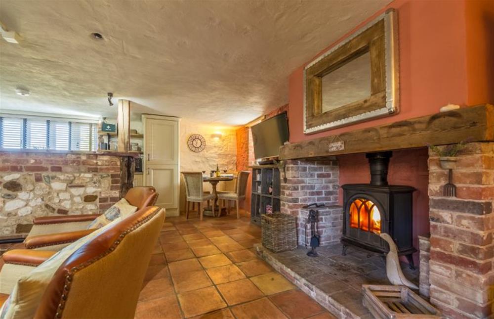 Ground floor: The open plan living area has wood burning stove at The Old Smithy, Holme-next-the-Sea near Hunstanton