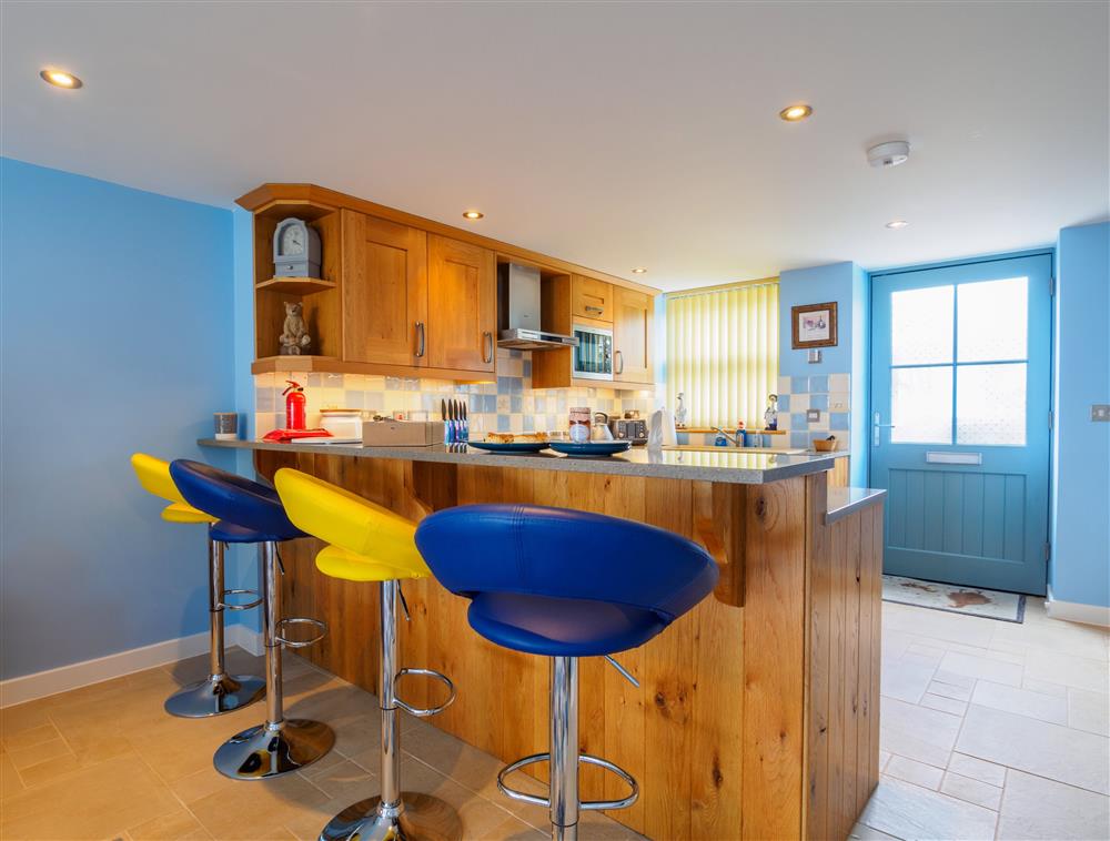 Ground floor: Open-plan living space with sit up breakfast bar  at The Old Smoke House, St Austell 