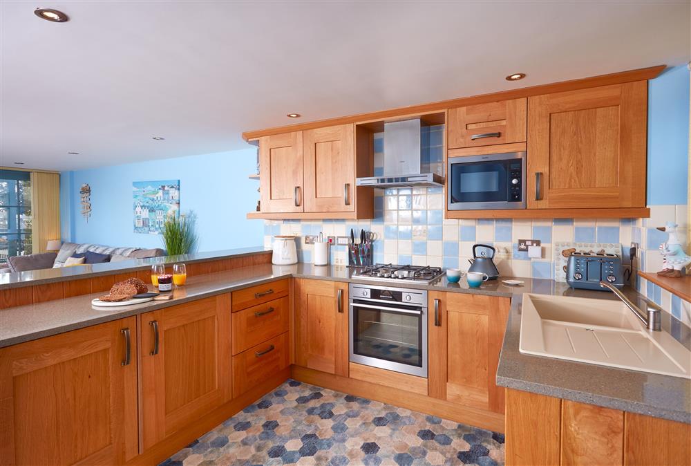 Ground floor: Open-plan living space with well-equipped kitchen  at The Old Smoke House, St Austell 