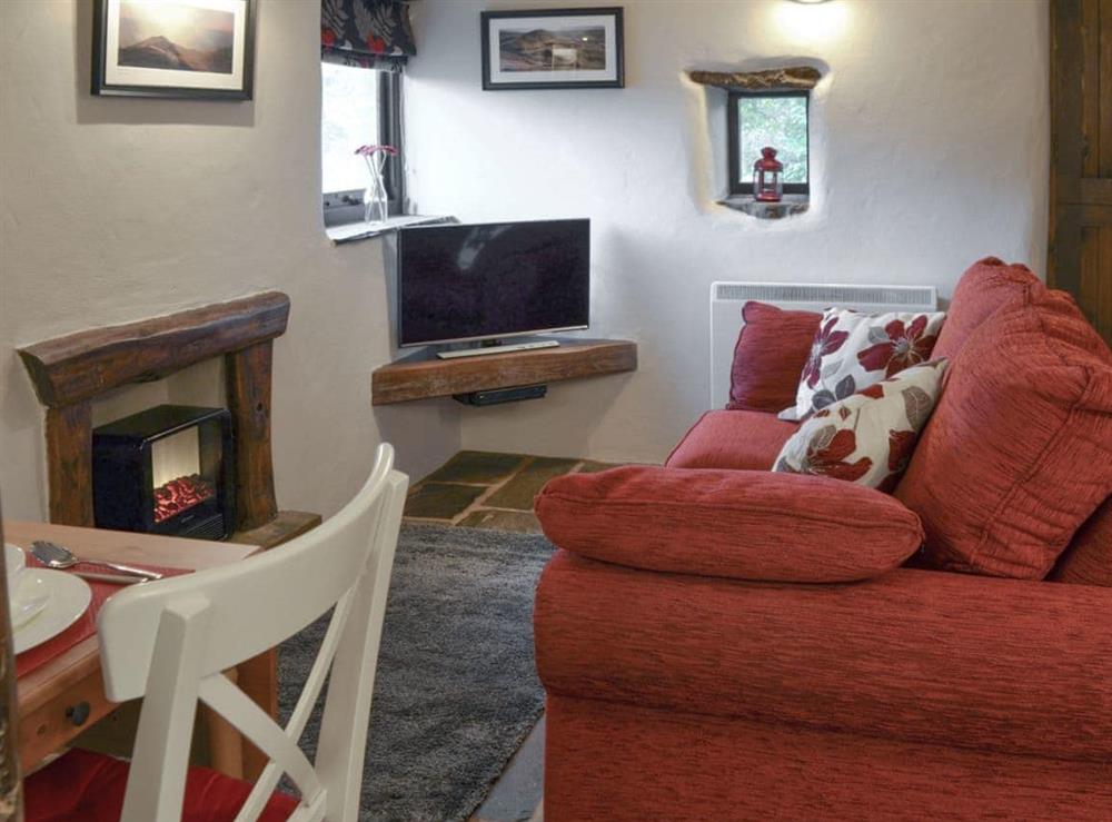 Cosy lounge area of open-plan living space at The Old Stable in Barber Booth, near Whaley Bridge, Derbyshire