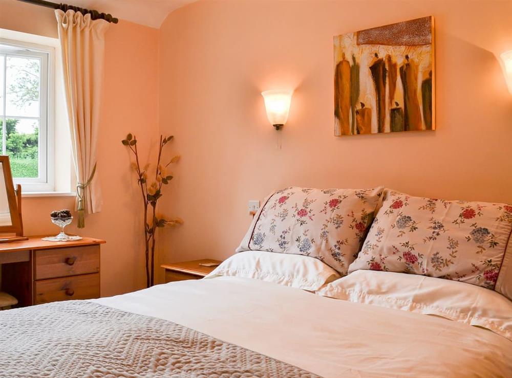 Warm and inviting double bedroom at The Old Stable in Lincoln, Lincolnshire