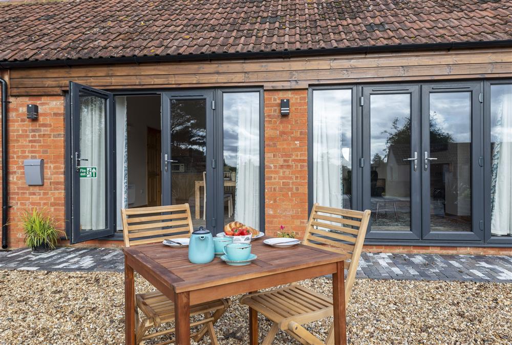 Ideal for alfresco dining with far reaching views at The Old Stables at Bradleys Farm, Holt