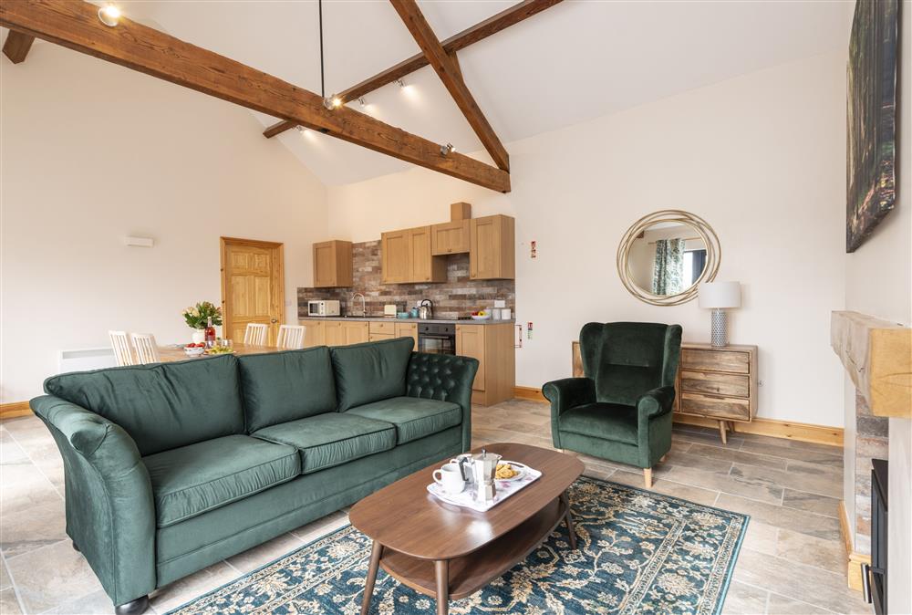 Open-plan living area with vaulted ceilings at The Old Stables at Bradleys Farm, Holt