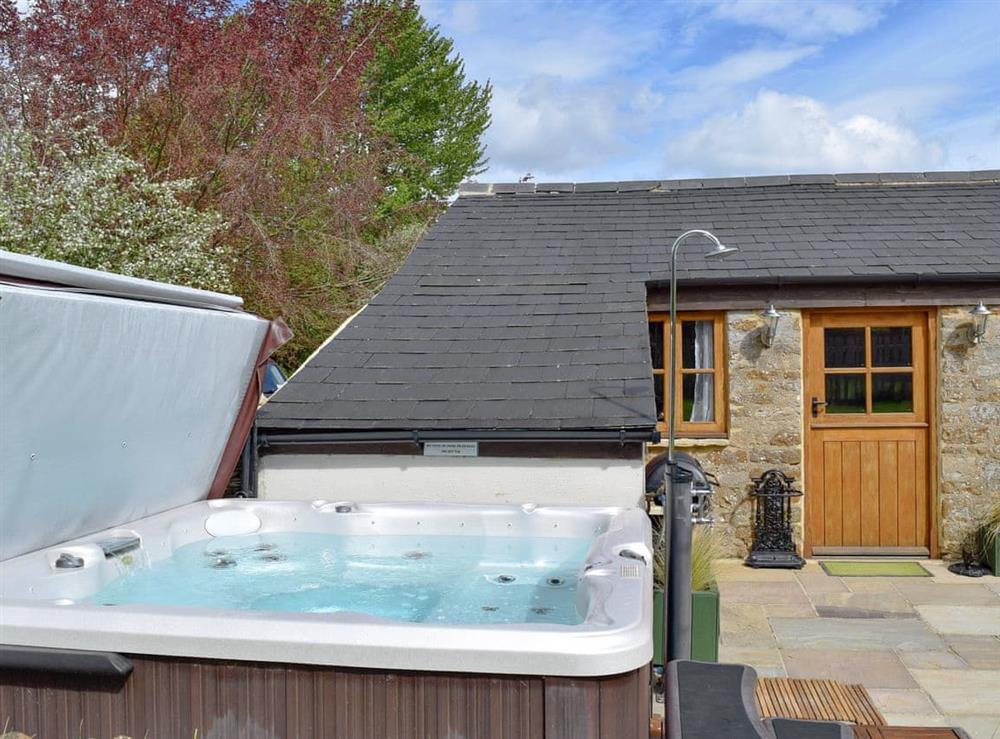 Realxing hot tub at The Old Stables in Swerford, near Chipping Norton, Oxfordshire