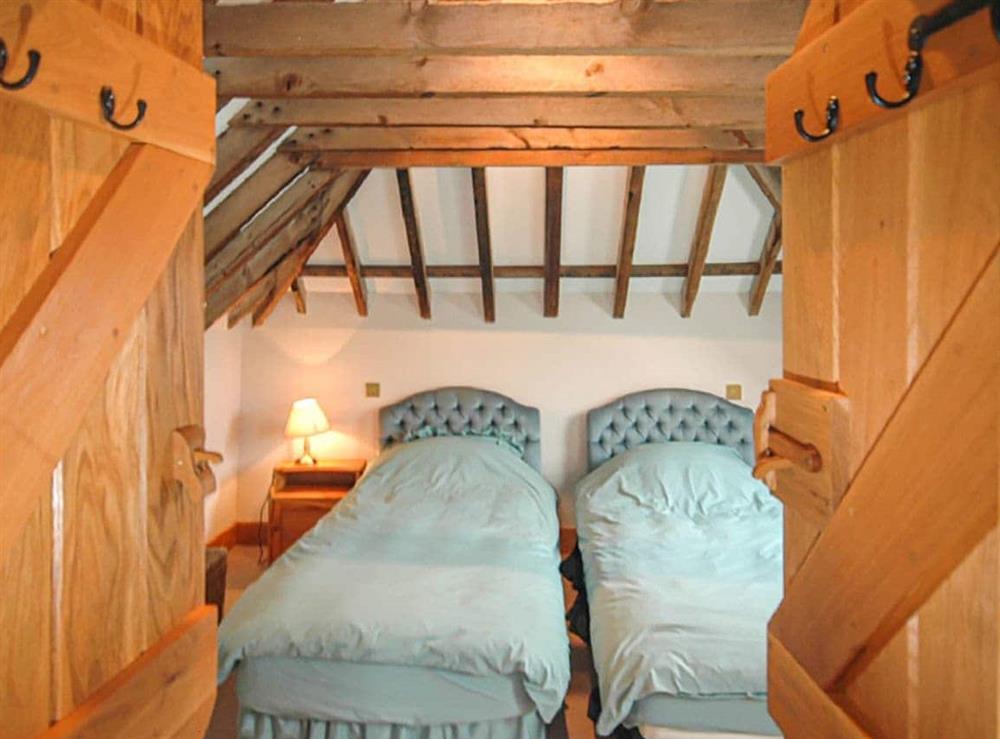 A bedroom in The Old Tractor Shed at The Old Tractor Shed in Sutton, West Sussex