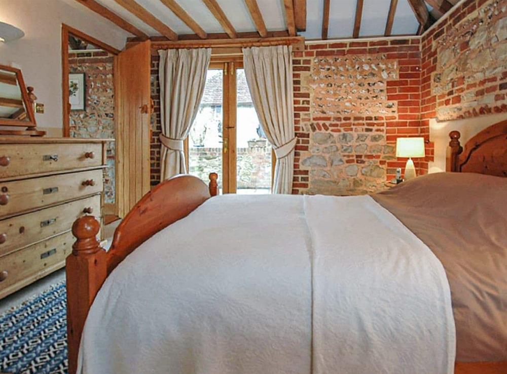 One of the bedrooms at The Old Tractor Shed in Sutton, West Sussex